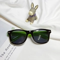 Kids polarized silicone sunglasses in bright black and green contrast with rivet detail - Black Frame Green Leg
