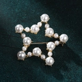 Star-shaped gold brooch featuring white pearls on a dark green textured background - xz4315 Five-pointed Star