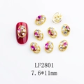 Macro detail of LF2801 nail art jewelry with oval gold frame and pink water drop stone - Gold Base Pink Teardrop Stone (2801)