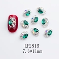 Detail of green oval crystal nail charm with silver hollow frame and rhinestones - Japanese Style Oval Nail Charm (2816) / 10 Pieces Pack