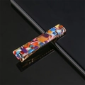 Close-up of a colorful mosaic pattern hair clip with a gold metal duckbill base - Bright Floral Pattern