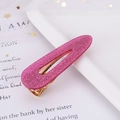 Close-up of pink glitter acetate hair clip with golden metal fastener and star accents - Glitter Rose Red Waterdrop