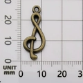 Antique bronze treble clef music note pendant on a millimeter scale grid for DIY jewelry - G-Clef-10891