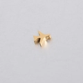 Close-up of golden mirror polished stainless steel airplane charm with a 1.8mm hole - 18K Gold