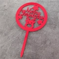 Red Merry Christmas acrylic cake topper with reindeer and stars on a grey surface - Red