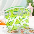 Detail of transparent PVC makeup bag featuring green watermelon print and green zipper - Green