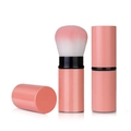 Detail of retractable makeup brush with pink gradient bristles and coral finish body - Pink Large