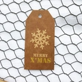 Brown kraft paper Christmas gift tag with gold Merry X'Mas lettering and snowflake pattern - Simple Style J