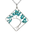 Detailed view of handmade square tree of life pendant featuring turquoise stone chips - Blue Turquoise