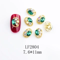 Detailed view of emerald glass nail art jewel with gold frame and mini pearl accent - Gold Base Emerald Stone (2804)