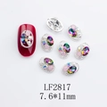 Detail of oval alloy nail jewelry with AB crystals and pearls in silver braided frames - Japanese Style Oval Nail Charm (2817) / 10 Pieces Pack