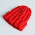 Classic bright red knitted beanie hat for kids and adults with soft ribbed texture - One Size / Red