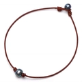 Detail of genuine brown leather cord necklace with two dark lustrous large pearls - Necklace / Brown
