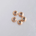 Primer plano de cuentas de tope de 8mm en acero dorado con revestimiento interior de goma - 8mm / Oro rosa