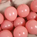 Stack of matte pink 10 inch 2.2g round latex balloons for party and wedding decor - Retro Pink