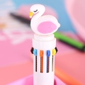 Cute white multi-color ballpoint pen featuring a cartoon swan topper on a pink desk - White Barrel - Swan