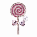 Detalle de un broche de piruleta rosa con pedrería en espiral, cristales y perla - Rosa