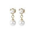 Elegant gold earrings featuring white pearls and sparkling crystals on white background - Stud Earrings / Gold
