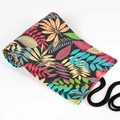 Roll-up canvas pencil case with vibrant tropical leaf print and black tie closure - Leaf Jungle