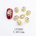 Detail of 7.6*11mm gold alloy nail art charm with oval hollow frame and rhinestones - Gold Base Clear Rhinestone (2802)