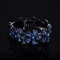Elegant bun maker hair clip with sparkling blue rhinestones in a floral pattern - Medium Flower Deep Blue / Medium