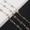 Handmade gold star eyewear chain with hollow stars and polished rhomboid metal links - Star Twist Bar