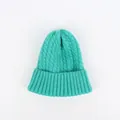 Detail of teal cable knit beanie showing thick texture and ribbed brim design - M (56-58cm) / Lake Green