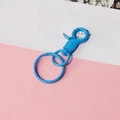 Close-up of a blue metal lobster clasp with a matching round key ring on a card - Sky Blue