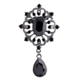 Vintage style silver brooch with oval black gemstones and intricate filigree details - Solid Black