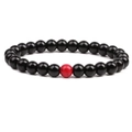 Polished black 8mm beaded bracelet set featuring a single red turquoise accent stone - Black Agate