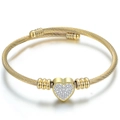 Golden cable twist open cuff bracelet with a sparkling heart-shaped zircon pendant - Gold