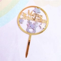 Macro detail of golden mirror acrylic Merry Christmas cake topper with reindeer and stars - Two-tone Gold Silver