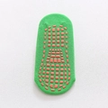 Green anti-slip toddler socks with orange square grip dots in a cute footprint pattern - 1-4 Years / Green