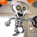 Skeleton skull foil balloon measuring 81x47cm for spooky Halloween party decorations - Dancing Skeleton