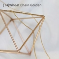 Detailed view of a gold wheat chain necklace featuring fine metal weaving on a stand - Wheat Chain / 50 cm / Gold