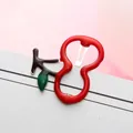 Cute cherry-shaped metal hair clip in red and green finish on a white display card - Red Cherry