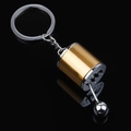 Detail of creative metal car gear shifter keychain with a polished gold and silver finish - Gold Gear Shifter