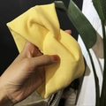 Bright yellow ribbed knit headband featuring a stylish front twist knot design - Cross / Yellow