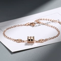 Elegant rose gold minimalist bracelet featuring a triple ring cylinder pendant and chain - Single Layer / Rose Gold