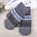 Winter gray knit mittens featuring blue and white snowflake patterns and thick warm wool - One Size / Dark Gray
