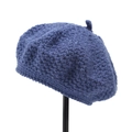 Detail of navy blue hand-knitted beret showing thick wool texture and top knot - M (56-58cm) / Blue