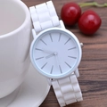 Classic white minimalist silicone watch with silver indices leaning on a cup - White