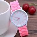 Classic slim silicone watch with white dial and pink strap on a wooden surface - Pink