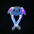 Detail of blue plush bunny hat with glowing colorful LED lights in a dark room - Blue Rabbit with LED Light