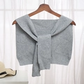 Elegant grey knitted shawl wrap with ribbed edge detail hanging on a wooden hanger - Mixed Grey