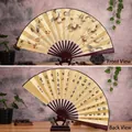 Chinese Nine Dragon folding fan with gold leaf paper and traditional calligraphy - 10-Inch Nine Dragons