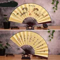 Traditional Chinese dragon fan with calligraphy and a dark red bamboo frame - 10-Inch Two Dragons Playing with a Pearl