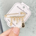 Broche musicale dorée avec notes en strass et pendentifs guitare en émail noir élégant - A7-9