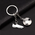 Silver metal keychain featuring detailed 3D football and soccer cleat charms - 3D Soccer Cleat Style (GX-155)