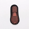 Black cotton yoga ankle sock with orange non-slip silicone grip dots on the sole - Black